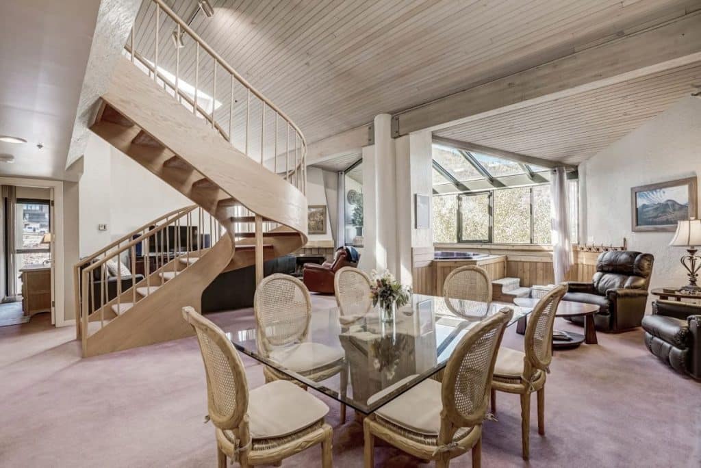 Spacious living area with vaulted ceilings and fireplace in Silver King Penthouse Room 513