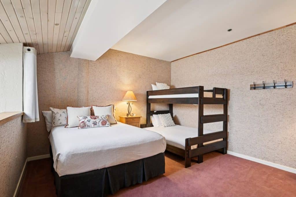 Open loft bedroom - bunk room, overlooking living area at Silver King condo