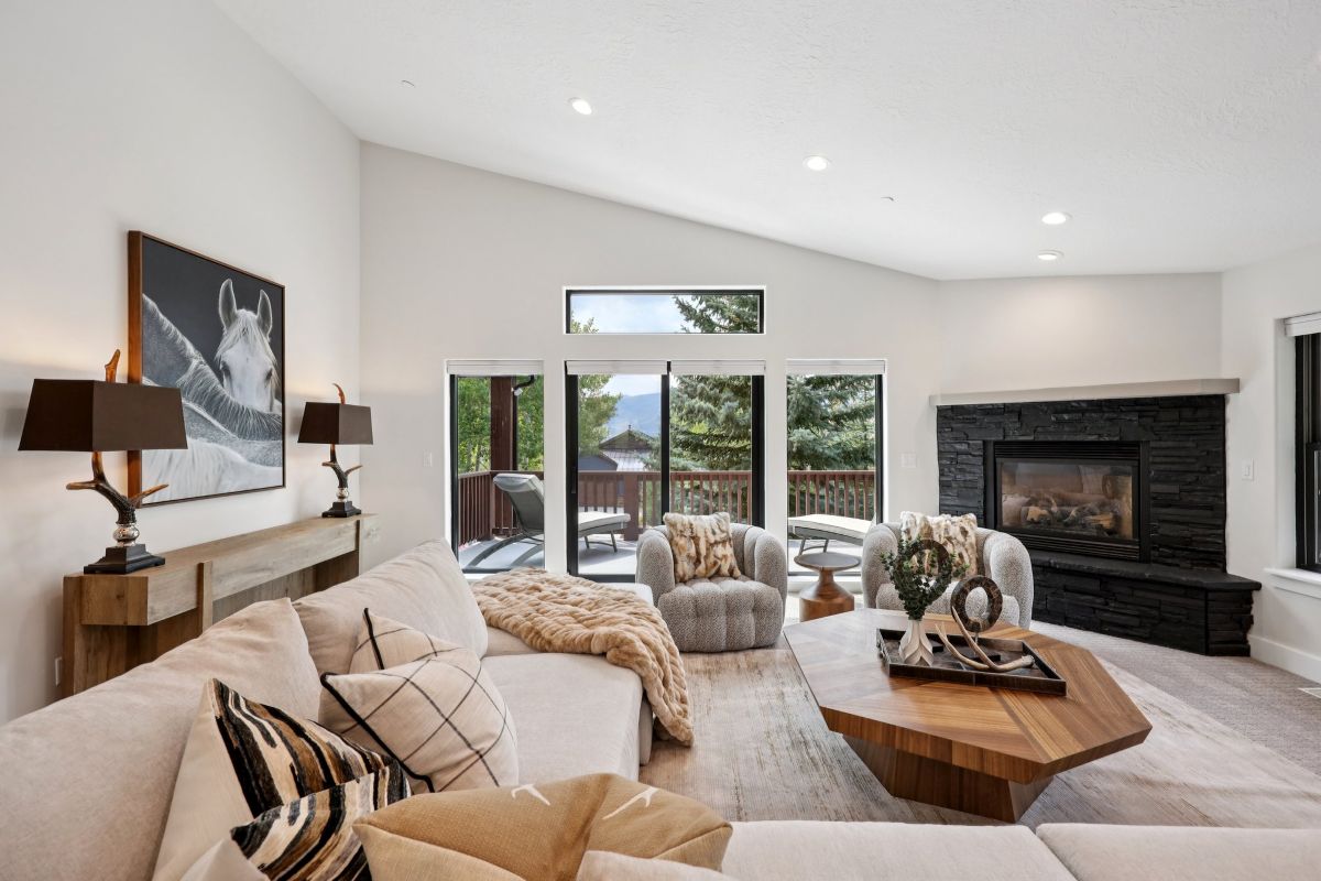 Bright living room with new paint, carpet, and mountain views at 12472 Ross Creek Drive in Deer Mountain