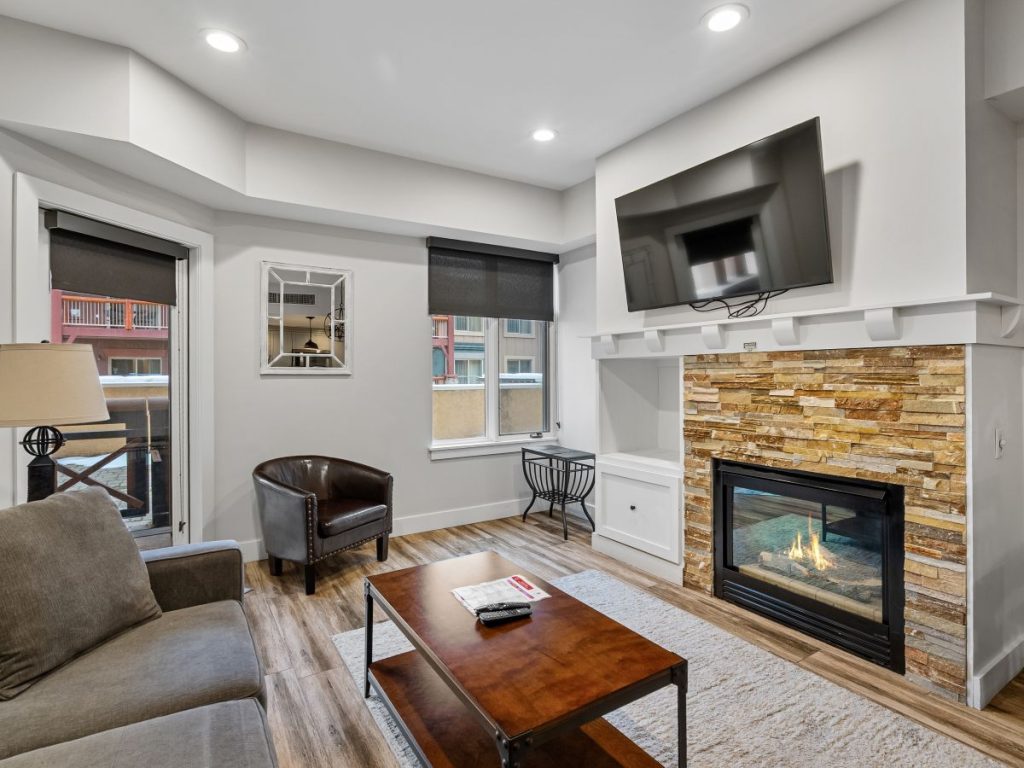 Living room with fireplace in Sundial Lodge unit C105 at Canyons Village Park City