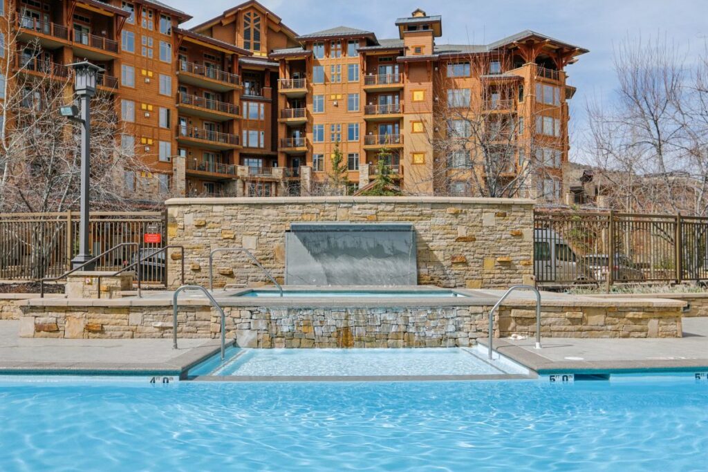 Heated outdoor pool and hot tubs at Hyatt Centric Park City with mountain views in Canyons Village Utah
