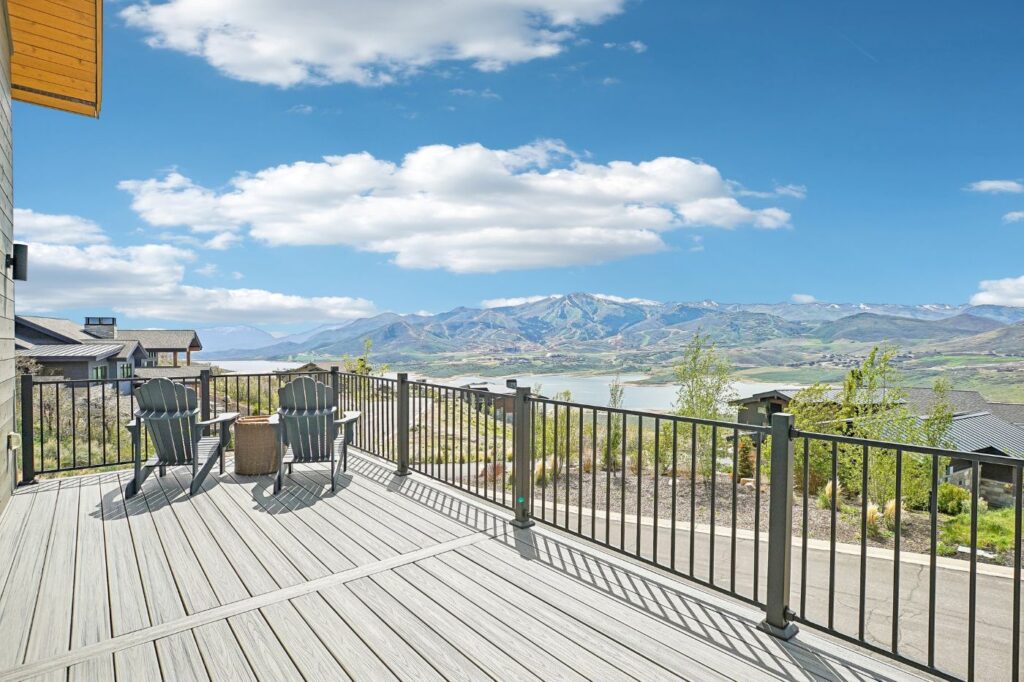 Panoramic views of Jordanelle Reservoir and Deer Valley Resort from the deck of a Soaring Hawk at Hideout home
