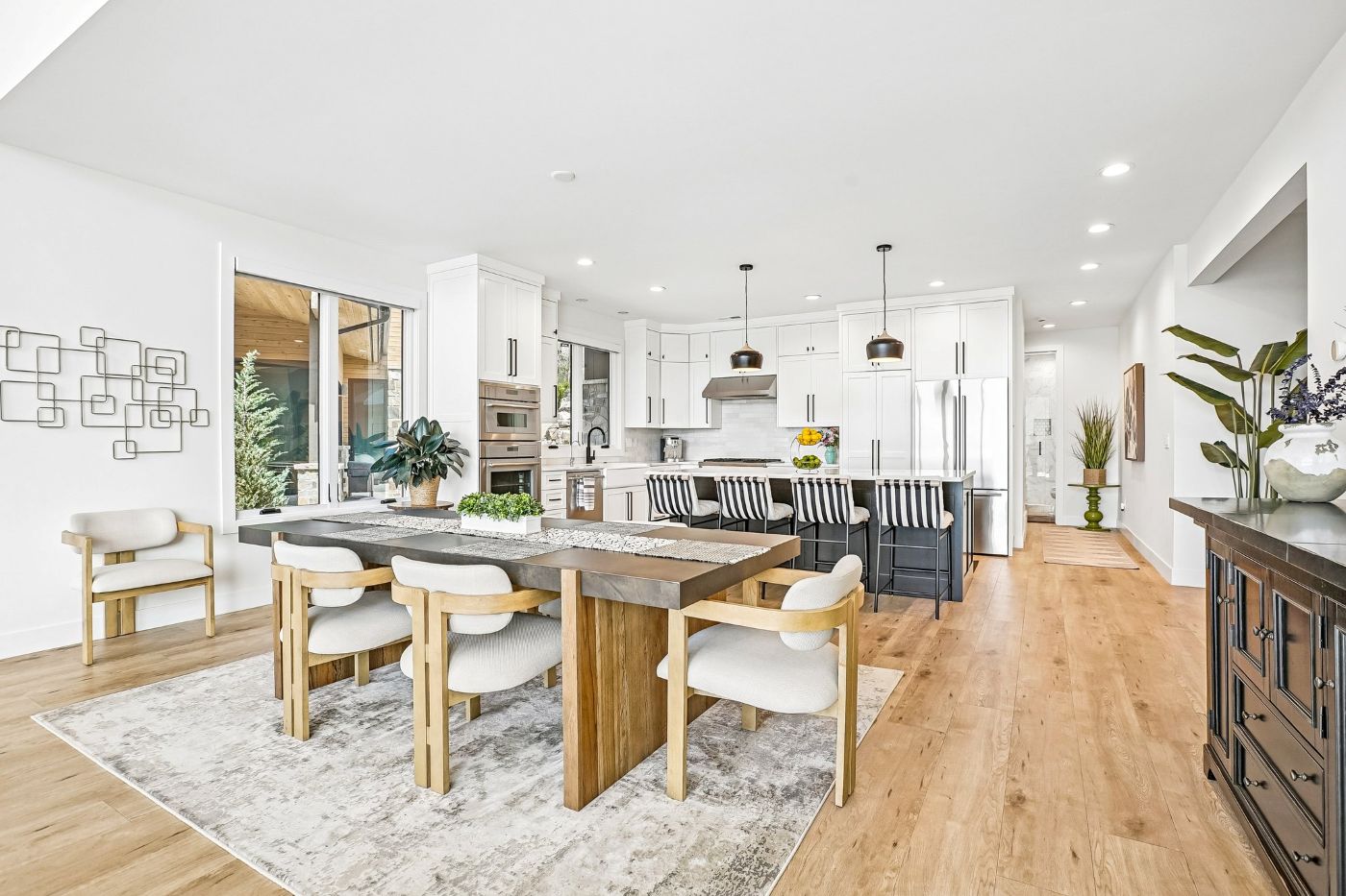 Mountain contemporary kitchen and dining area in a Soaring Hawk at Hideout home near Park City