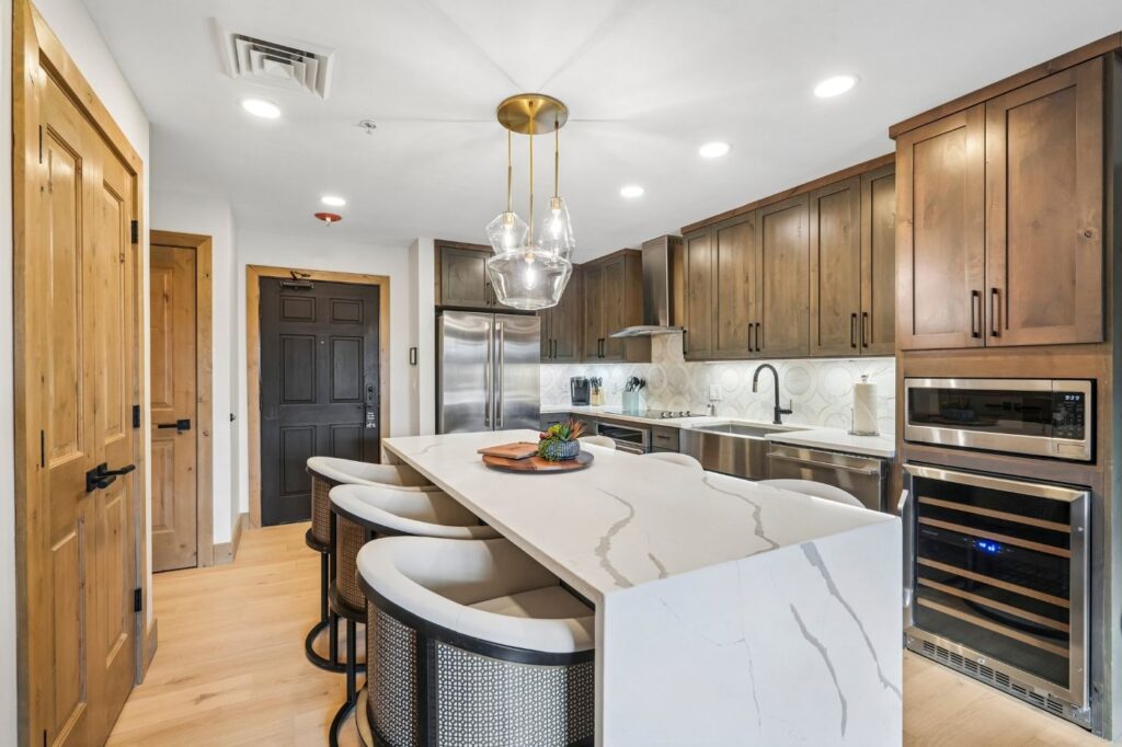 Updated kitchen in Westgate Park City condo #3301A featuring GE Monogram stainless steel appliances and granite countertops.